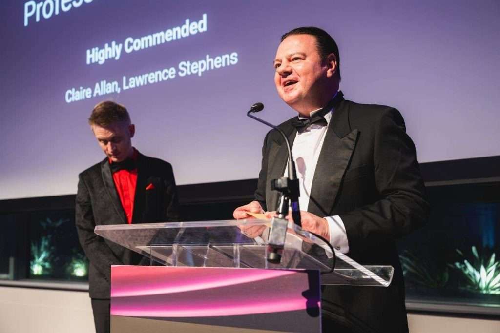 John M at awards ceremony